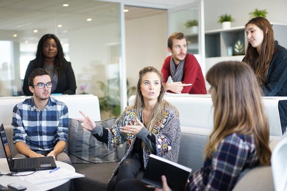 what-is-agile: a stock image of a group of people discussing
